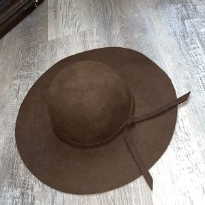 The brand is EB. A brown felt hat.